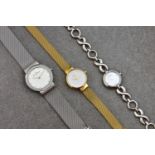 Three ladies quartz bracelet watches, the first a gold plated Obaku Spire, ref. V199LXGIMG, with