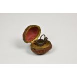 A French walnut shell etui, 19th century, with gilt metal interior and silver fittings, 1¾in. (4.
