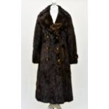 A vintage mahogany ranch mink full length coat, 1960s-70s, with striped silk lining, vented back,