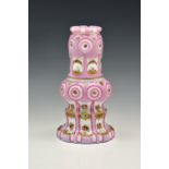 A 19th century Bohemian cut cased glass carafe, possibly by Moser, in pink agate cased white