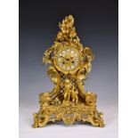 A 19th century French gilt bronze rococo revival mantel clock, in the Louis XV style, the twin train