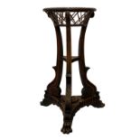 A fine Regency mahogany jardiniére, possibly Irish, the top tier with carved rope twist over lattice