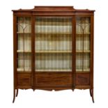 An Edwardian mahogany breakfront glazed display cabinet by Maple & Co., crossbanded with ebony and