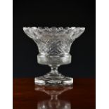 A 19th / early 20th century Waterford style cut glass pedestal bowl, the bell shaped bowl with blaze