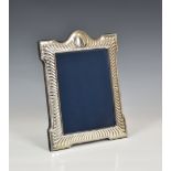 A Victorian style silver easel back photo frame, John Bull Ltd, Sheffield 1990, rectangular form