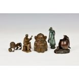 Five bronze figurines, comprising a heavy Billiken imp figure, 3¼in. (8.4cm.) high; a Lion with