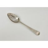 A Channel Islands silver bright cut Old English pattern teaspoon, maker's mark PN struck twice (