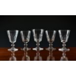 A matched set of ten early to mid-19th century wine glasses, the bucket bowls with panel cut