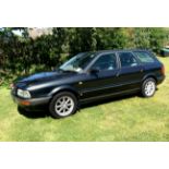 A 1995 Audi 80 2.6 V6 Avant estate, in Volcano Black Metallic with light grey cloth interior, a