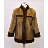 A vintage two-tone mink short jacket, 1970s, by Pandora of Guernsey, the palomino mink with darker
