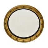 A Regency style giltwood convex mirror, mid-20th century, the cavetto frame with ball ornament and