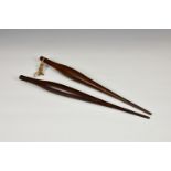 Two early 19th century mahogany sailors rope splicing fid tools, of elongated turned form, 17in. (