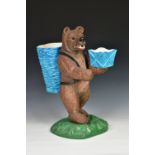A large antique Majolica style Black Forest fireside bear, the bear standing on hind legs and