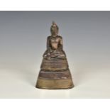 A 19th century Thai silver-metal model of Buddha, of typical form, seated in meditation on a