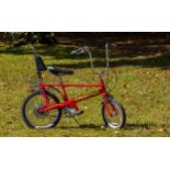 A Raleigh Chopper MK3 retro bicycle, early 2000s, frame No. SF40502342, in 'red' with yellow decals,