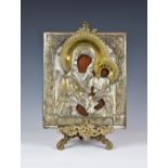 Russian Icon (possibly 19th century), Madonna and Child, parcel gilt frame, Cyrillic inscription, 12
