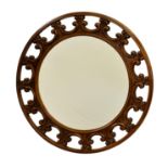 A modern Italian circular mirror, in carved and pierced frame, 20in. (50.8cm.) diameter.