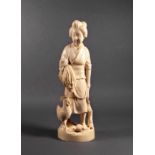 A Japanese carved ivory figure of a female peasant farmer, Meiji period (1868-1912), with a bundle