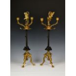 A pair of ormolu and patinated three branch candelabra by Auguste Maximilien Delafontain (1813-