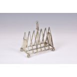 A novelty Victorian silver plate cricket theme toast rack, Atkin Brothers, diamond registration
