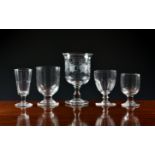 A collection of 19th century glasses, including an oversized goblet with vine etched bell bowl,