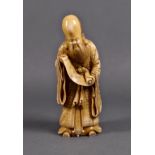 A Japanese carved ivory figure of the immortal Jurojin, Edo period, 19th century, the finely