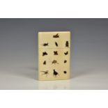 A Japanese Shibayama and ivory card case, Meiji period (1868-1912), of rounded rectangular form with