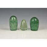 Two Victorian green glass dumps, with bubble decoration, the taller 5in. (12.7cm.) high, together