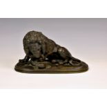 After Paul-Edouard Delabrierre (French, 1829-1912), a patinated bronze model of a Lion attacking a
