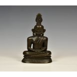 A Sri Lankan bronze figure of a seated Buddha, probably 18th century or earlier, Guardian of the