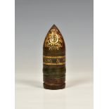 An unusual 'Vickers Sons & Maxim Ld' gilt decorated bullet paperweight, the bullet decorated with