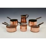 A matched graduated set of five antique copper saucepans, 19th century, three with lids, all with