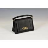 An Anya Hindmarch Rope Bow Mini Leather Handbag, in black with yellow gold hardware, in its original
