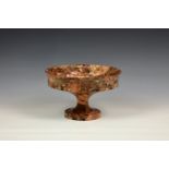 A carved marble tazza, 20th century, the shallow, cup form bowl with slightly everted rim, raised on