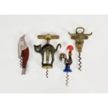 Four novelty animal related corkscrews, comprising a rollover frame witch's cat corkscrew; a Bull'