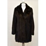 A Blackglama three quarter length ranch mink jacket, by Faulkes of Edgbaston, Birmingham, with three