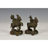 A pair of 19th century miniature Indian bronze temple toys, depicting ancient Indian warriors on