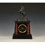 A late 19th century slate and red marble mantel clock, the French twin train movement striking the