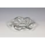 A vintage Sven Palmquist for Orrefors clear glass organic swirl bowl, of stylised flower head