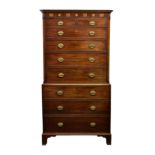 A Channel Islands George III mahogany chest on chest, the dentil and feather banded cornice with