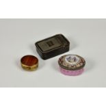 A Bilston enamel patch box, of ribbed oval form, powder pink ground, the hinged cover decorated with