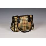 A canvas Burberry handbag,