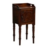 A Regency mahogany bedside cabinet, the three quarter gallery with pierced handles over a single