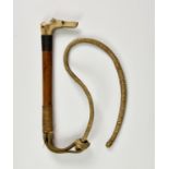 A child’s Riding Crop with white metal collar and bone dog head whistle handle, probably early