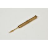 A 9ct gold retractable tooth pick, with engine turned design and hanging loop, weight 6.5 grammes.