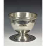A large polished pewter 'POMMERY' champagne punch bowl and stand, of circular form, with ornate