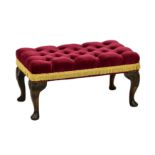 A Queen Anne style mahogany piano stool, the top with buttoned rich magenta and gold upholstery over