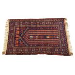 A Persian prayer rug on blue ground, 53 x33½in. (134.6 x 85cm.).