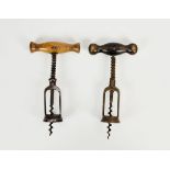 Two German twin pillar spring assisted mechanical corkscrews, of similar design with turned wooden