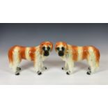 A pair of Scottish Bo'ness pottery St Bernards dogs, with glass eyes and gilt collars, 12½in. (31.